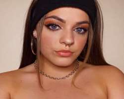 She has a piercing in her nose septum as well as over six piercings in her ears.